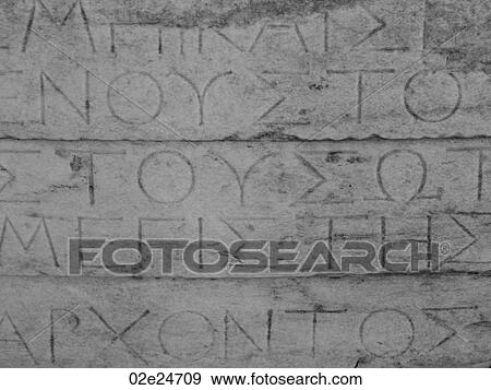 Stock Photo - Greek lettering on ancient ruins in Athens Greece. Fotosearch
