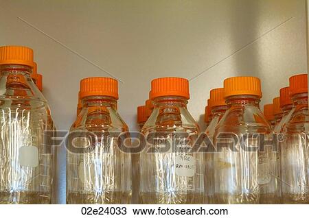 Stock Image - Grouping of glass lab bottles.. Fotosearch