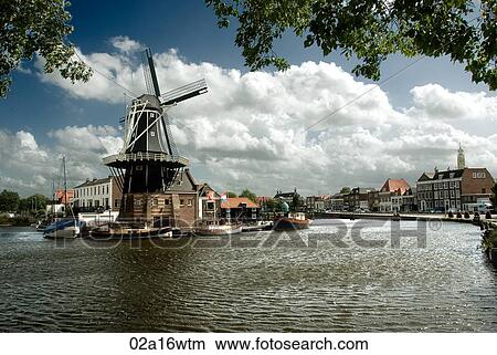 Picture - Haarlem canal and De Adriaan windmill, Holland. Fotosearch