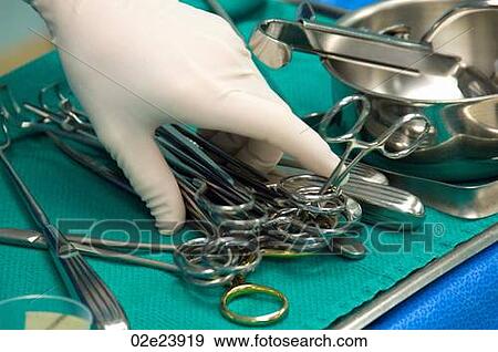 Hand reaching for surgical scissors. View Large Photo Image Stock Photo - Hand reaching for surgical scissors.. Fotosearch
