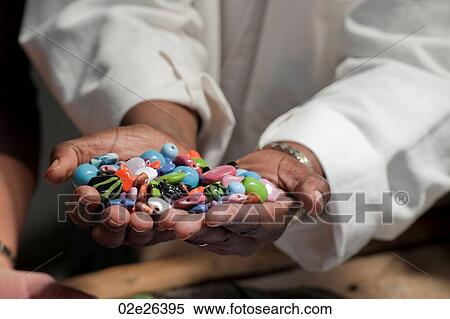 Hands holding colorful beads View Large Photo Image Stock Photography - Hands holding colorful beads. Fotosearch