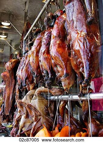 Stock Photography - Hanging BBQ'd ducks in Chinese restaurant.. Fotosearch