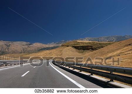 Highway road with mountain view View Large Photo Image Stock Image - Highway road with mountain view. Fotosearch