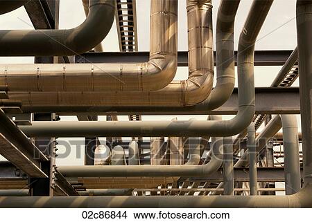 Industrial pipes and duct-work flowing in various directions. View Large Photo Image Picture - Industrial pipes and duct-work flowing in various directions.. Fotosearch