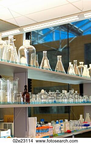 Picture - Lab bench with glass beakers and flasks.. Fotosearch