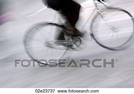 Stock Photo - Legs of person riding bicycle.. Fotosearch