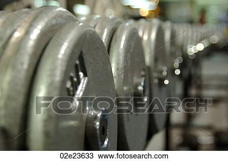 Line of free weights. View Large Photo Image Stock Image - Line of free weights.. Fotosearch