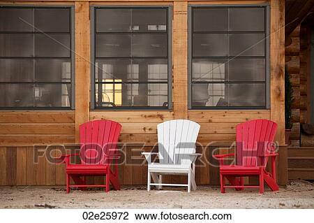Stock Image - Lounge chairs on a deck in Gimli, Manitoba, Canada. Fotosearch