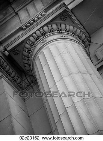 Stock Image - Low angle of stone Corinthian pillar.. Fotosearch