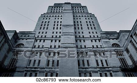Stock Image - Low angle view of ominous building in London England.. Fotosearch
