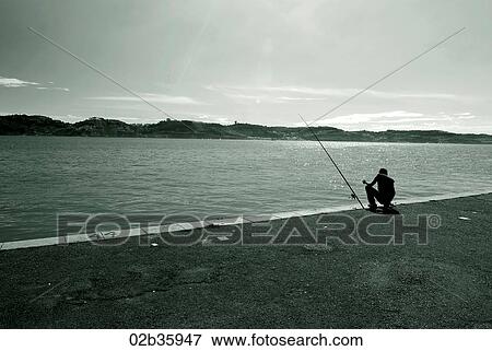 Man fishing along Tejo River View Large Photo Image Stock Photo - Man fishing along Tejo River. Fotosearch