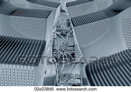 Many computers networked via cables. View Large Photo Image Stock Photograph - Many computers networked via cables.. Fotosearch