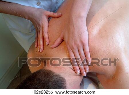 Massage therapist giving spa treatment. View Large Photo Image Stock Photography - Massage therapist giving spa treatment.. Fotosearch