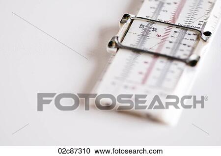 Stock Image - Measuring Slide Ruler on white background.. Fotosearch