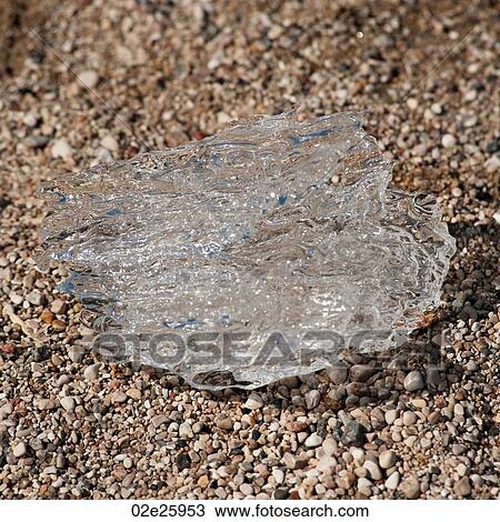 Melting ice on the beach. View Large Photo Image Stock Image - Melting ice on the beach. . Fotosearch