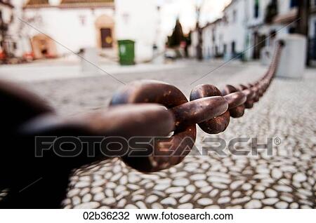 Metal chain in town square, Granada, Spain View Large Photo Image Stock Image - Metal chain in town square, Granada, Spain. Fotosearch