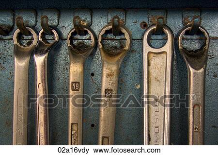 Metal spanners hanging in workshop View Large Photo Image Stock Photo - Metal spanners hanging in workshop. Fotosearch
