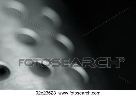 Stock Image - Metal with holes punched thought it.. Fotosearch