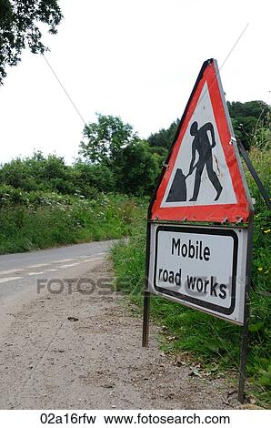 Mobile road works sign on a rural lane View Large Photo Image Stock Photo - Mobile road works sign on a rural lane. Fotosearch