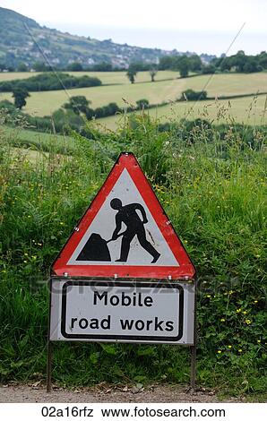 Mobile road works sign on a rural lane View Large Photo Image Stock Photo - Mobile road works sign on a rural lane. Fotosearch