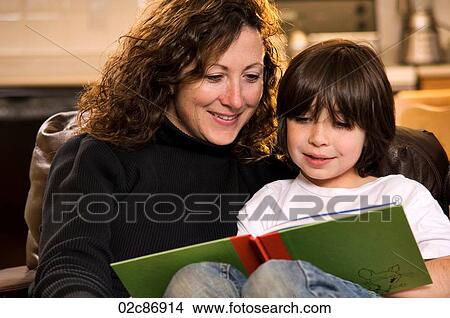 Picture - Mom and son reading a book.. Fotosearch