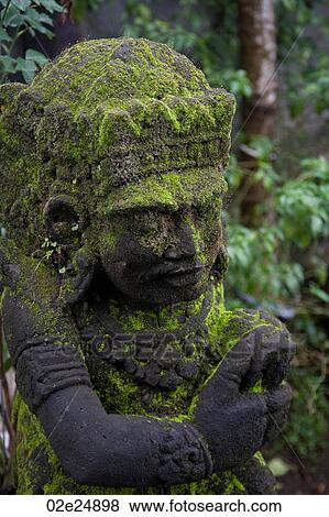 Stock Photo - Moss on a statue in Bali. Fotosearch