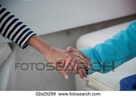 Mother and child holding hands View Large Photo Image Stock Photo - Mother and child holding hands. Fotosearch