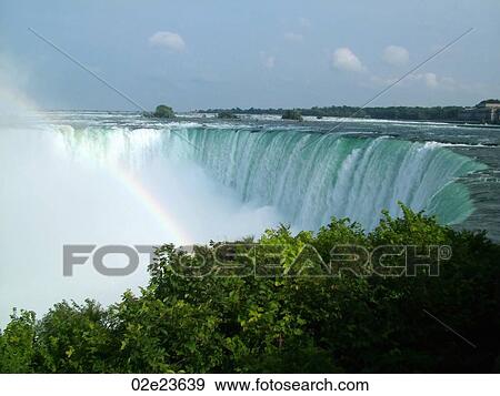 Niagara Falls with rainbow. View Large Photo Image Stock Photo - Niagara Falls with rainbow.. Fotosearch