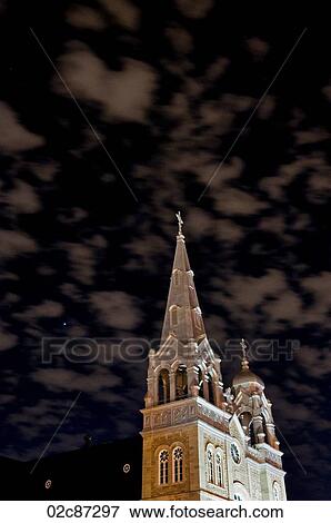Night shot of a Catholic church with eerie sky. View Large Photo Image Stock Photo - Night shot of a Catholic church with eerie sky.. Fotosearch