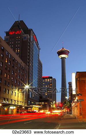 Stock Image - Night view of Calgary's Hyatt hotel and Calgary Tower.. Fotosearch
