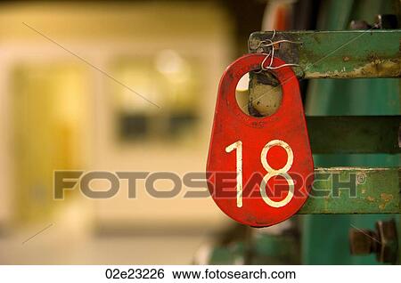 Number 18 on hanging tag. View Large Photo Image Stock Photograph - Number 18 on hanging tag.. Fotosearch