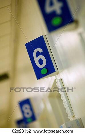Numbers above hospital examination rooms. View Large Photo Image Stock Image - Numbers above hospital examination rooms.. Fotosearch