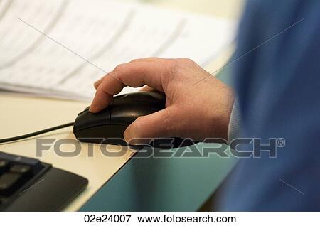 Nurse using mouse while filling out patient's electronic records. View Large Photo Image Stock Photo - Nurse using mouse while filling out patient's electronic records.. Fotosearch