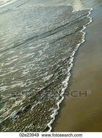 Stock Photo - Ocean surf coming to shore.. Fotosearch