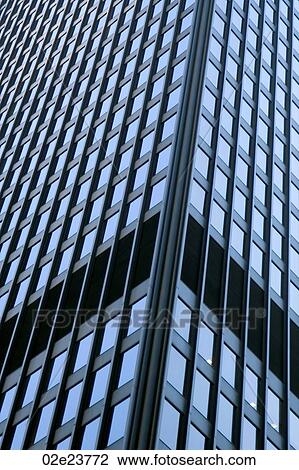 Stock Image - Office building with architectural detail pointing up.. Fotosearch