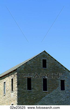 Old brick house under a blue sky. View Large Photo Image Stock Photography - Old brick house under a blue sky.. Fotosearch