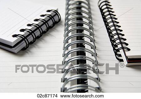 Opened blank coiled note pads. View Large Photo Image Picture - Opened blank coiled note pads.. Fotosearch