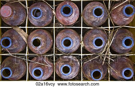 Overview of a crate of rusty bottles View Large Photo Image Stock Photo - Overview of a crate of rusty bottles. Fotosearch