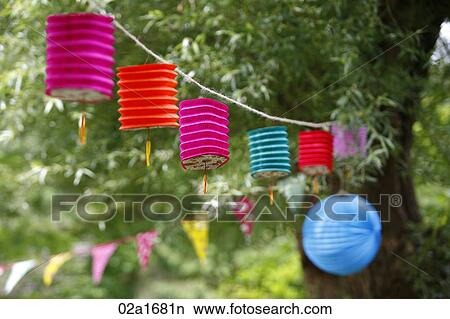 Paper lanterns hanging from a tree View Large Photo Image Picture - Paper lanterns hanging from a tree. Fotosearch