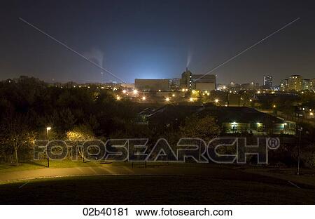 Park setting with industrial backdrop View Large Photo Image Stock Image - Park setting with industrial backdrop. Fotosearch