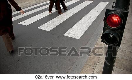 People crossing the road at red light on pedestrian crossing View Large Photo Image Stock Photography - People crossing the road at red light on pedestrian crossing. Fotosearch