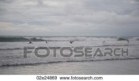 People swimming by shoreline in Bali View Large Photo Image Stock Photo - People swimming by shoreline in Bali. Fotosearch
