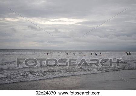 People swimming by the shoreline in Bali View Large Photo Image Stock Image - People swimming by the shoreline in Bali. Fotosearch