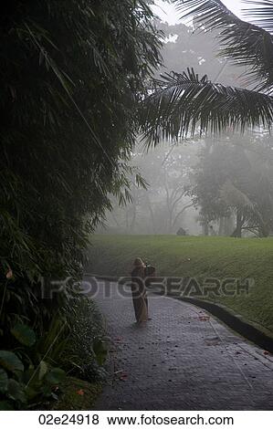 Stock Photo - Person on pathway in Bali. Fotosearch