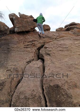 Person standing on top of hill in Kenya Africa View Large Photo Image Stock Image - Person standing on top of hill in Kenya Africa. Fotosearch