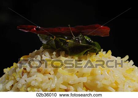 Pilau Rice with Red Chilli, Curry leaf and Mustard Seeds View Large Photo Image Stock Image - Pilau Rice with Red Chilli, Curry leaf and Mustard Seeds. Fotosearch