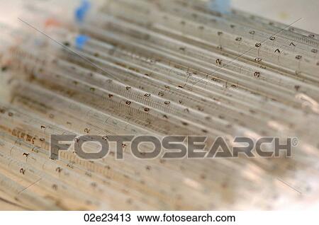 Stock Image - Pile of test measurement tubes.. Fotosearch