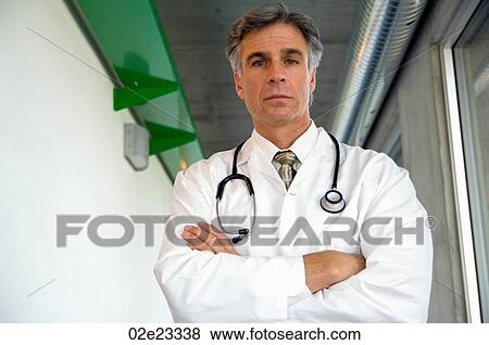 Portrait of a serious male physician. View Large Photo Image Stock Photo - Portrait of a serious male physician.. Fotosearch