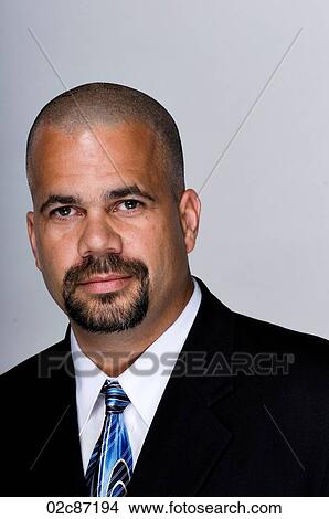 Portrait of serious business man in a suit and tie. View Large Photo Image Picture - Portrait of serious business man in a suit and tie.. Fotosearch