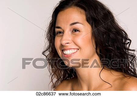 Portrait of smiling woman with bare shoulders. View Large Photo Image Stock Photo - Portrait of smiling woman with bare shoulders.. Fotosearch